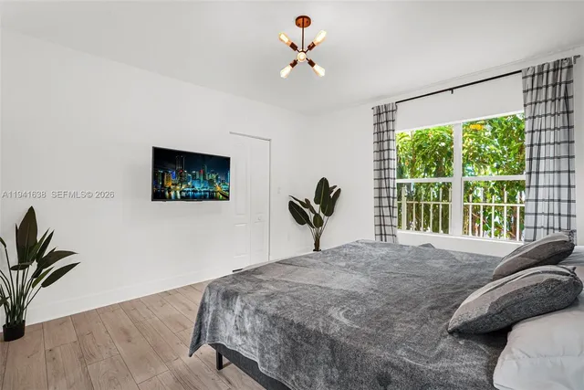 a kitchen with stainless steel appliances a stove microwave and sink