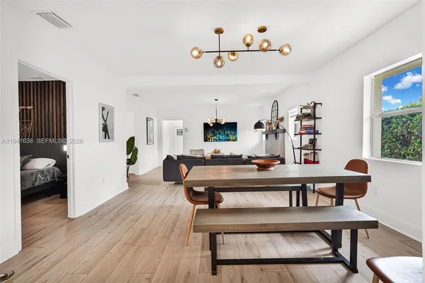 a bedroom with a bed and a chair