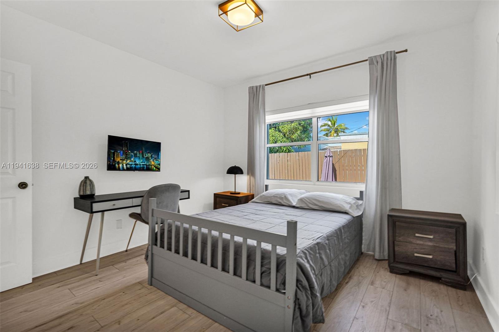 37 Northwest 47th Street Miami, FL 33127 - Photo 36 of 83 a bedroom with a bed and a window