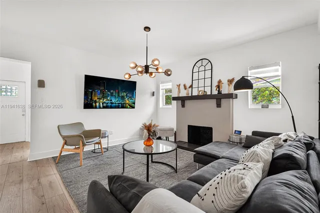 a living room with furniture and a fireplace