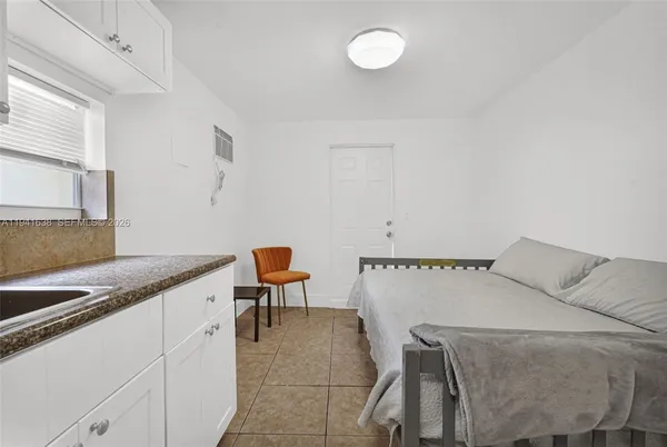 a view of a house with a backyard and a garden