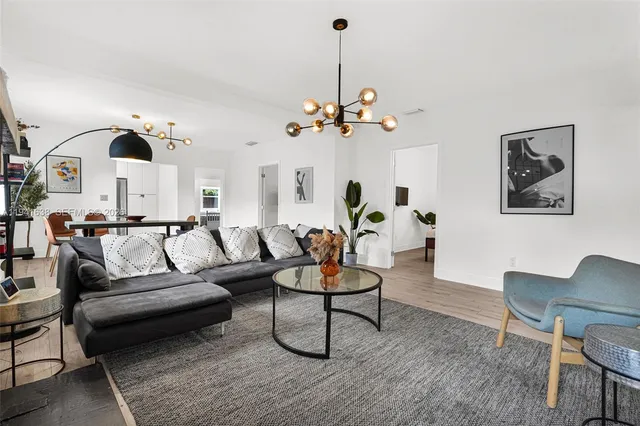 a bedroom with a bed dresser and a window