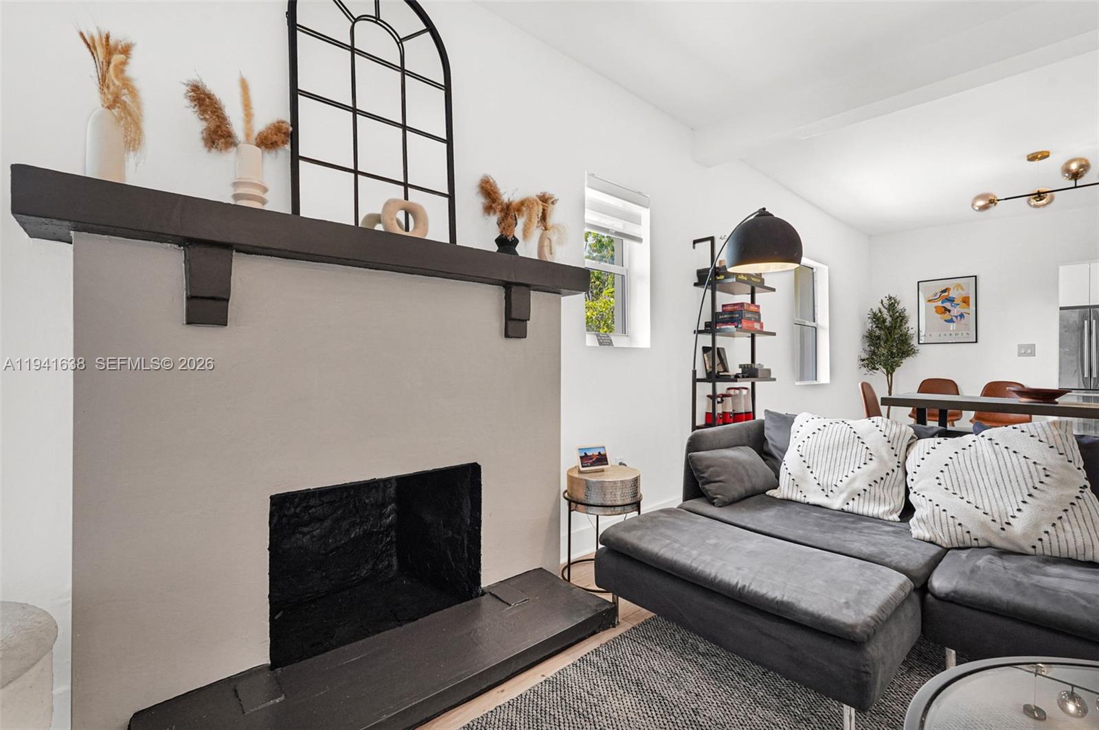 37 Northwest 47th Street Miami, FL 33127 - Photo 7 of 83 a living room with furniture and a fireplace