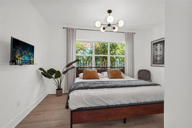 a bedroom with a bed and a table