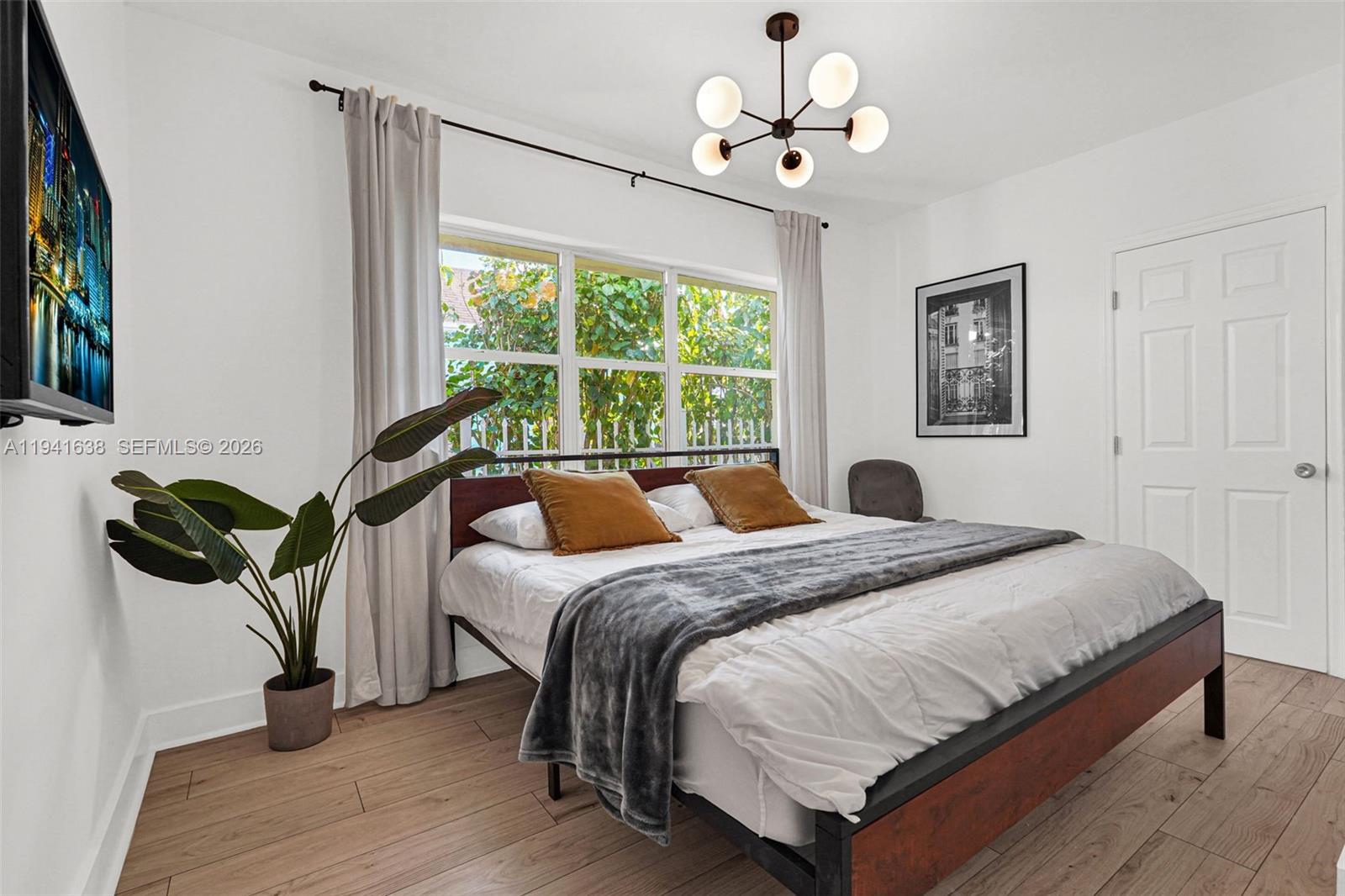 37 Northwest 47th Street Miami, FL 33127 - Photo 10 of 83 a bedroom with a bed dresser and a window