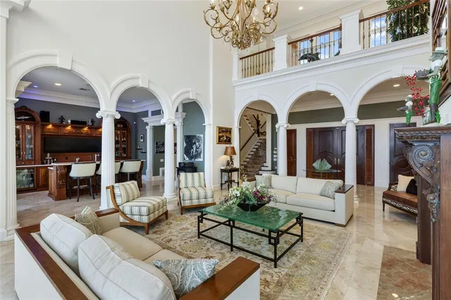 a view of a dining room and livingroom with furniture