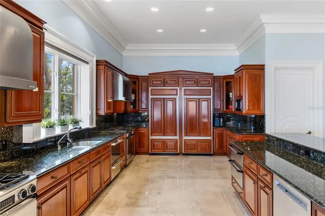 a view of a hallway with livingroom and furniture