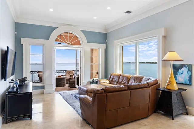 a living room with furniture fireplace and rug