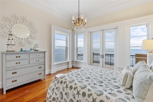 a view of a balcony with wooden floor and ocean view