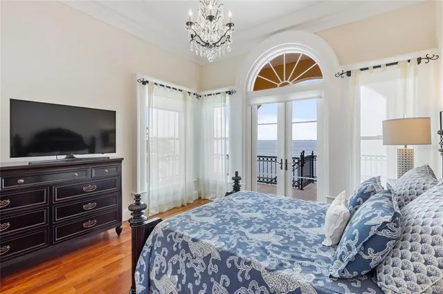 a view of a lake with a floor to ceiling window