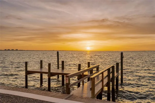 a view of a swimming pool with lounge chairs