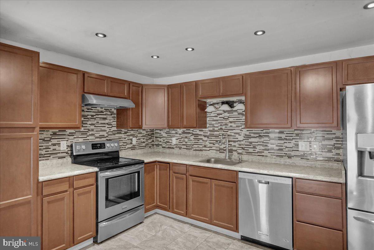 185 West Wesner Road Blandon, PA 19510 - Photo 5 of 28 a kitchen with stainless steel appliances granite countertop a stove sink and cabinets