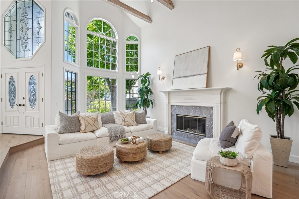 Undisclosed Address Manhattan Beach, CA 90266 - Photo 1 of 1 a living room with furniture fireplace and a large window