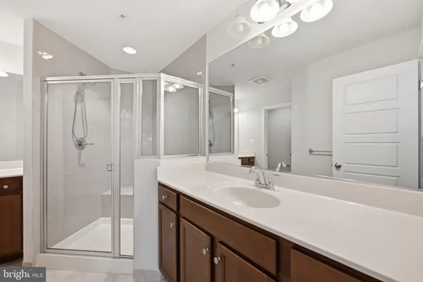 a bathroom with a sink double vanity and a mirror