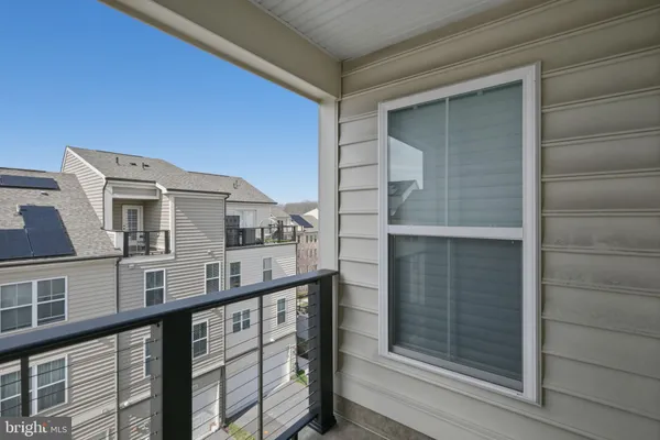 a view of a balcony with a couple of car parked