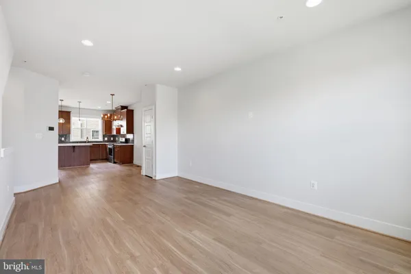 a view of a kitchen with a sink and a stove top oven