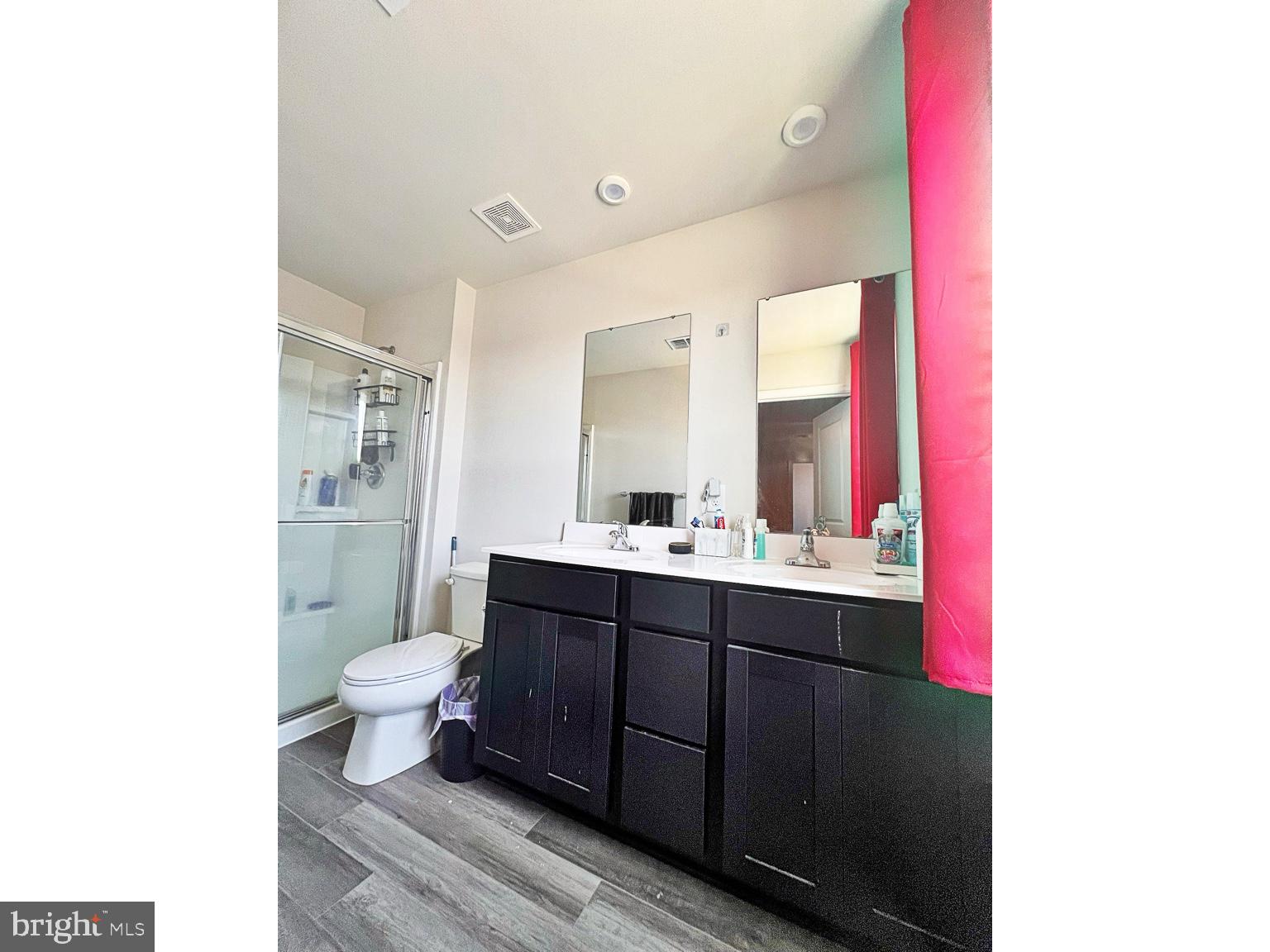 94 Opal Drive Dover, DE 19904 - Photo 11 of 18 a bathroom with a sink toilet a mirror and vanity