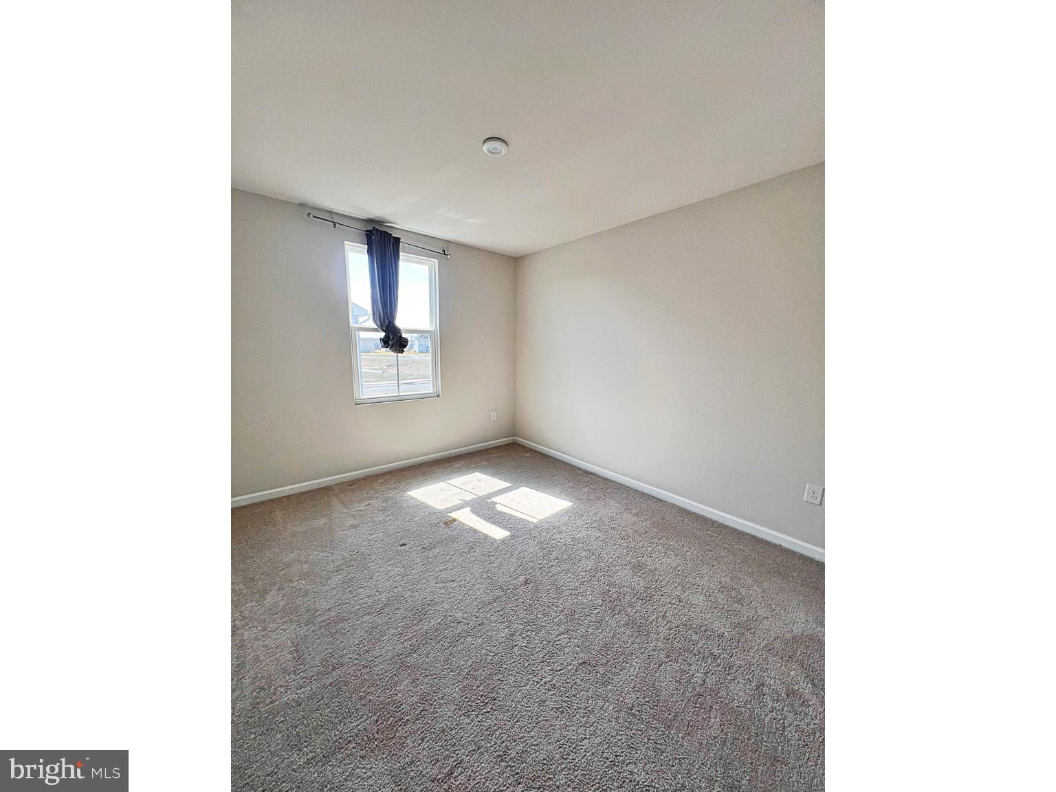 94 Opal Drive Dover, DE 19904 - Photo 13 of 18 a view of empty room with windows