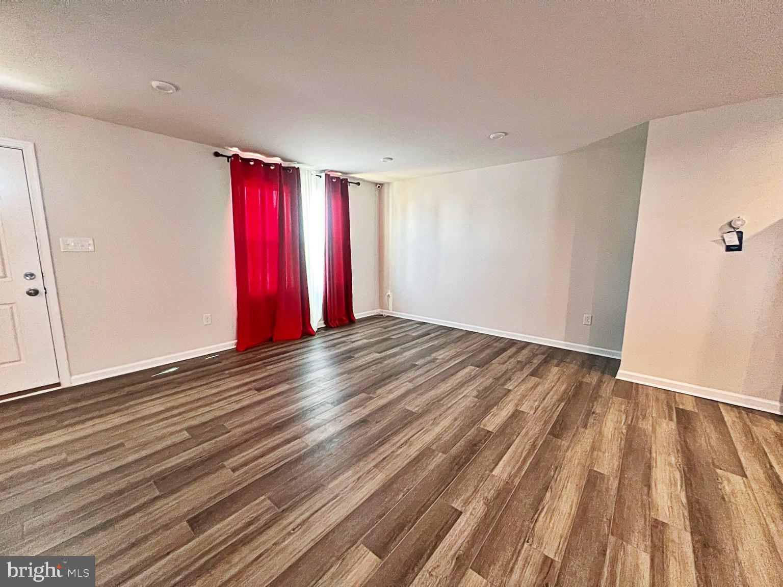 94 Opal Drive Dover, DE 19904 - Photo 2 of 18 a view of a room with wooden floor and window