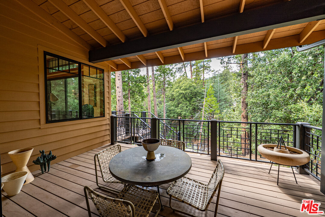 25445 Fern Valley Road Idyllwild, CA 92549 - Photo 18 of 45 a backyard of a house with table and chairs