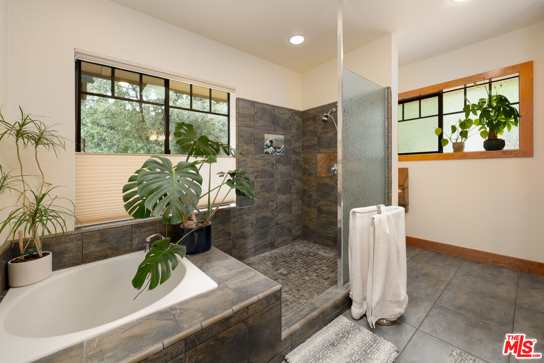 25445 Fern Valley Road Idyllwild, CA 92549 - Photo 20 of 45 a white bath tub sitting in front of a window