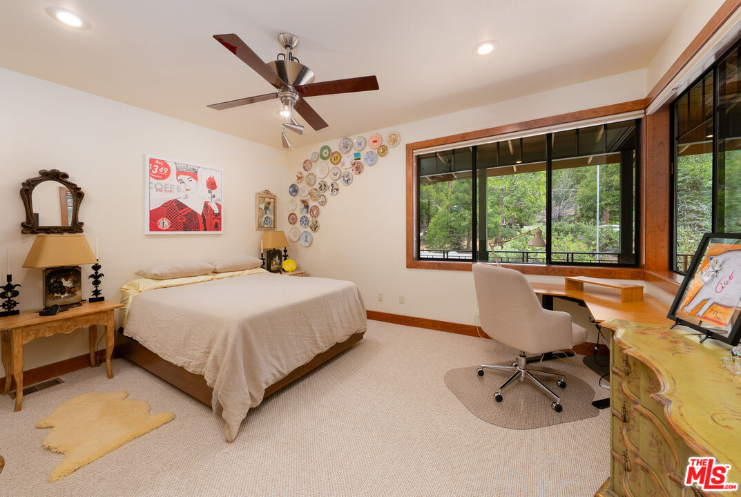25445 Fern Valley Road Idyllwild, CA 92549 - Photo 24 of 45 a bedroom with a bed and a large window