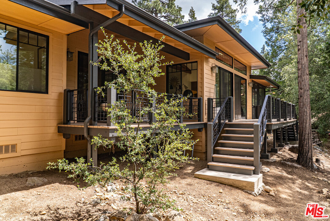 25445 Fern Valley Road Idyllwild, CA 92549 - Photo 26 of 45 a view of a house with a door and wooden walls