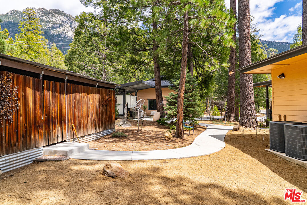 25445 Fern Valley Road Idyllwild, CA 92549 - Photo 32 of 45 a view of a house with backyard and sitting area