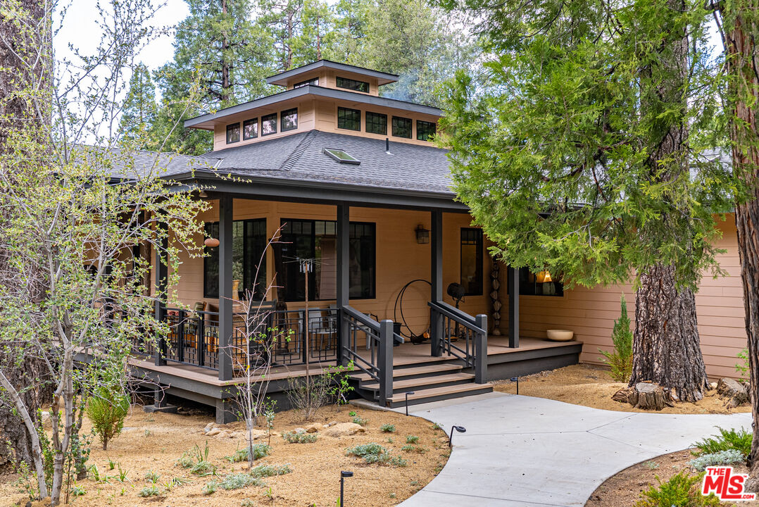 25445 Fern Valley Road Idyllwild, CA 92549 - Photo 36 of 45 a view of a house with backyard sitting area and garden