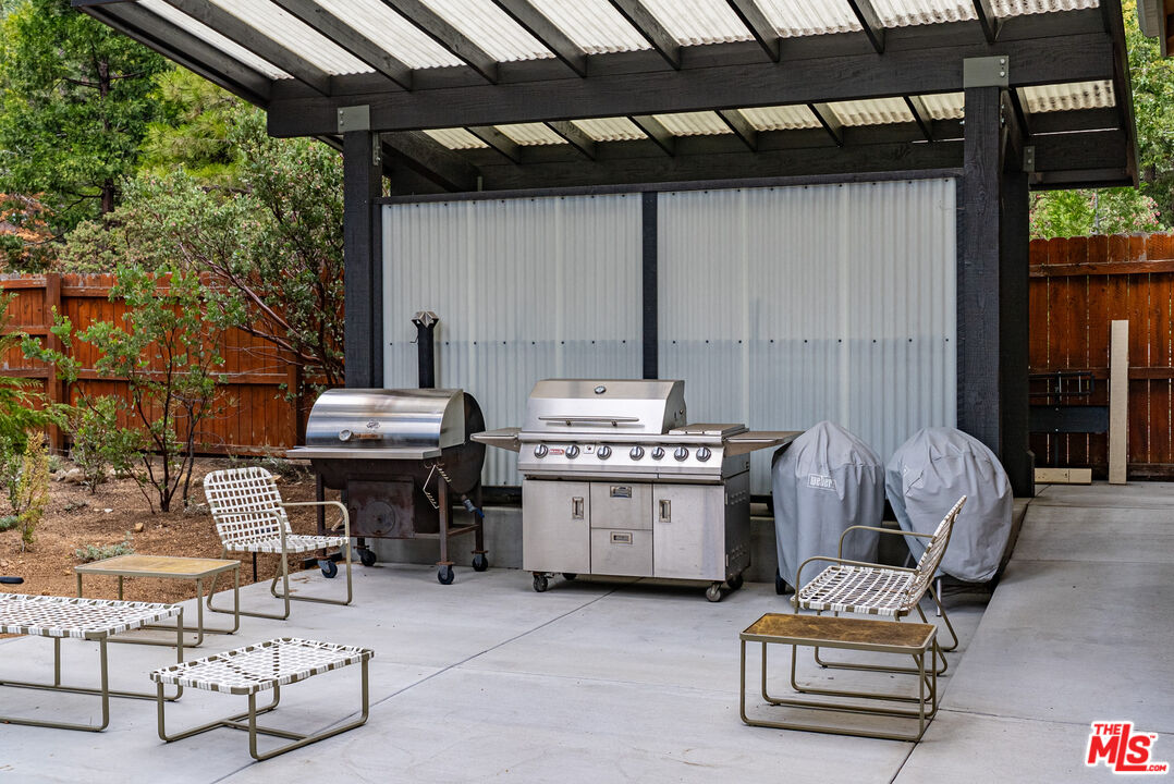 25445 Fern Valley Road Idyllwild, CA 92549 - Photo 38 of 45 a view of backyard with barbeque grill and outdoor seating