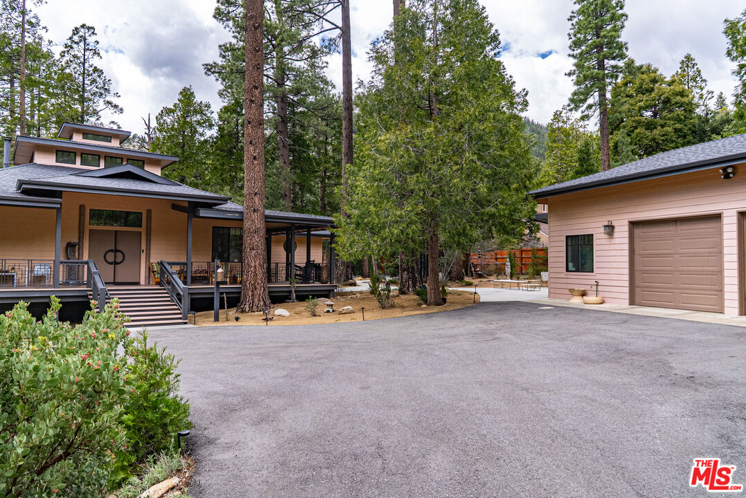 25445 Fern Valley Road Idyllwild, CA 92549 - Photo 40 of 45 a view of a house with sitting area and garden