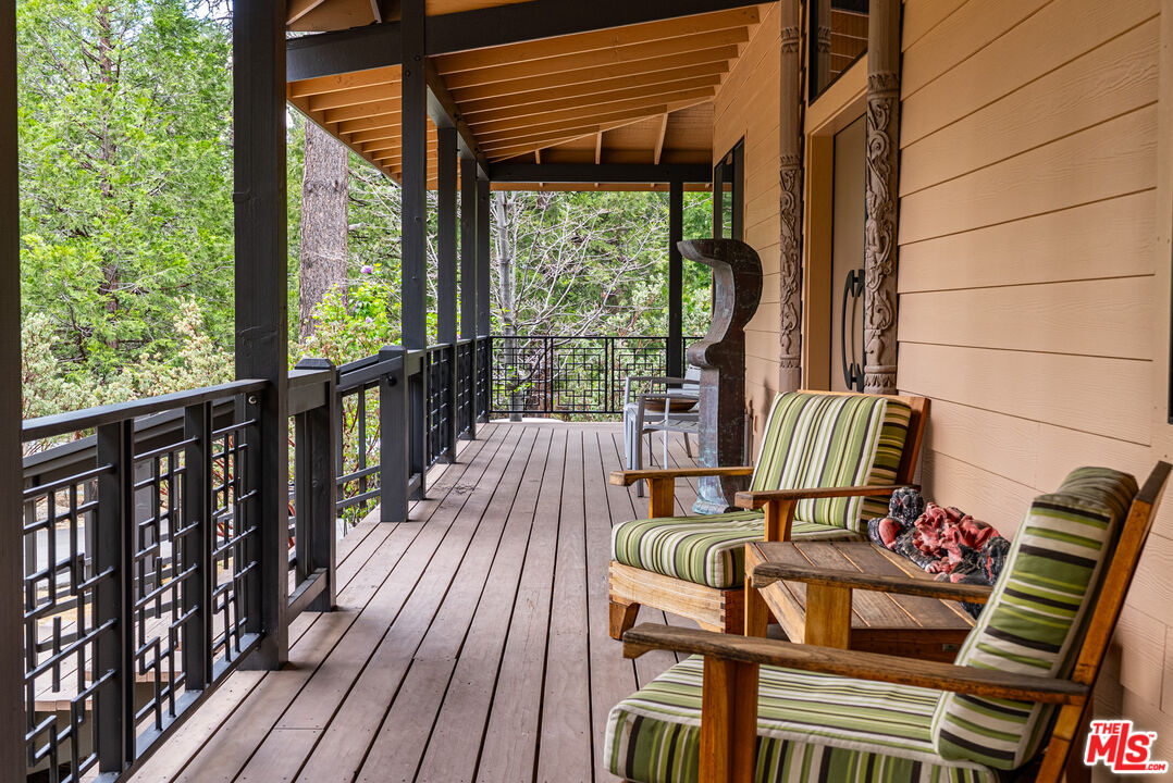 25445 Fern Valley Road Idyllwild, CA 92549 - Photo 4 of 45 a view of balcony with wooden floor and outdoor seating