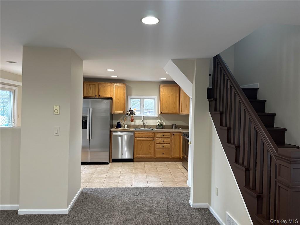 100 Dunderberg Road Putnam Valley, NY 10579 - Photo 25 of 29 a kitchen with refrigerator and cabinets