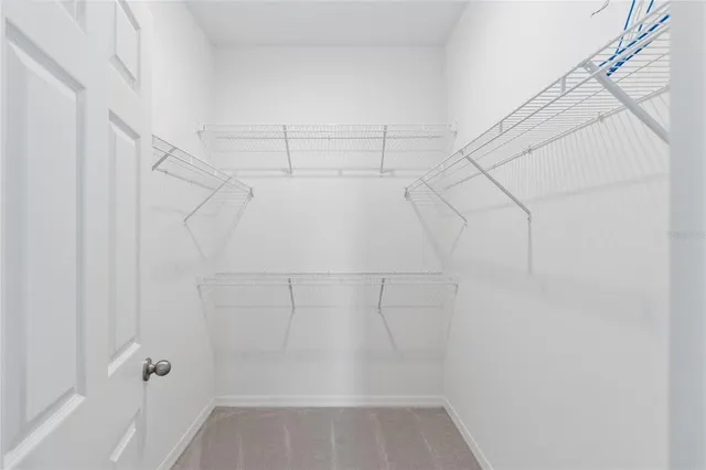 a bedroom with bed and a window