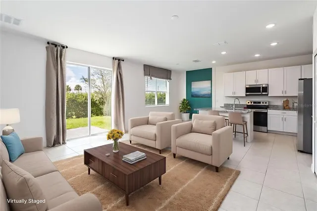 a view of kitchen with microwave and cabinets