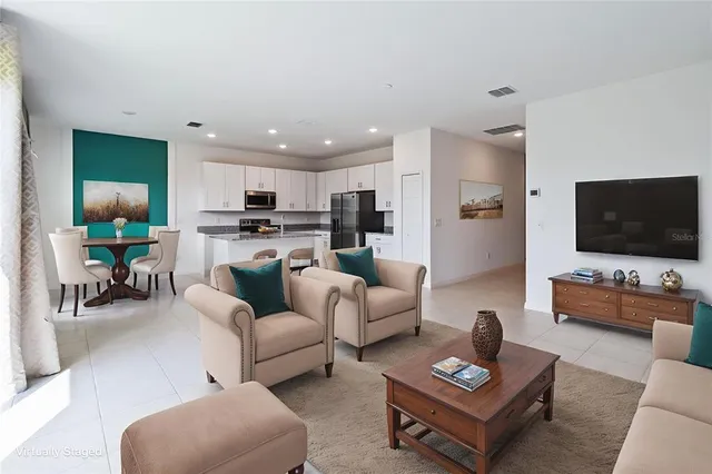 a view of a kitchen with a sink and a refrigerator
