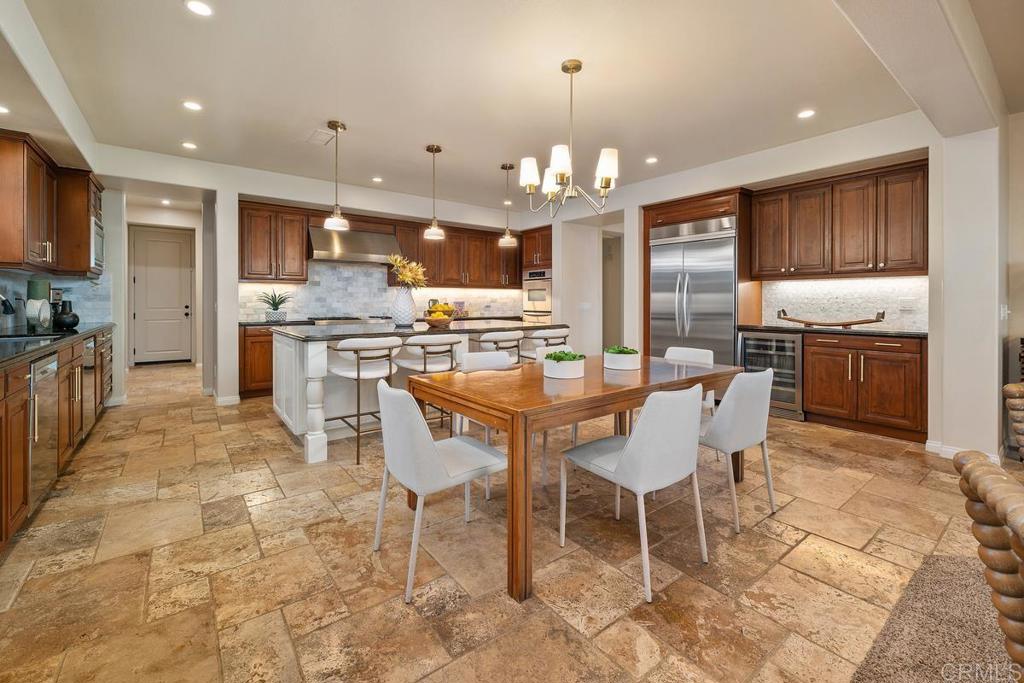 7603 Circulo Sequoia Carlsbad, CA 92009 - Photo 15 of 61 a large kitchen with a table and chairs