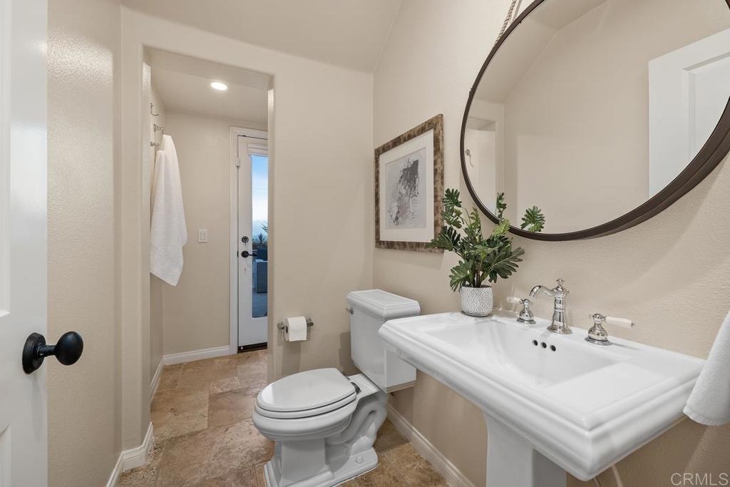 7603 Circulo Sequoia Carlsbad, CA 92009 - Photo 25 of 61 a bathroom with a sink toilet and a mirror