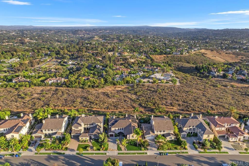 7603 Circulo Sequoia Carlsbad, CA 92009 - Photo 26 of 61 an aerial view of residential building with green space