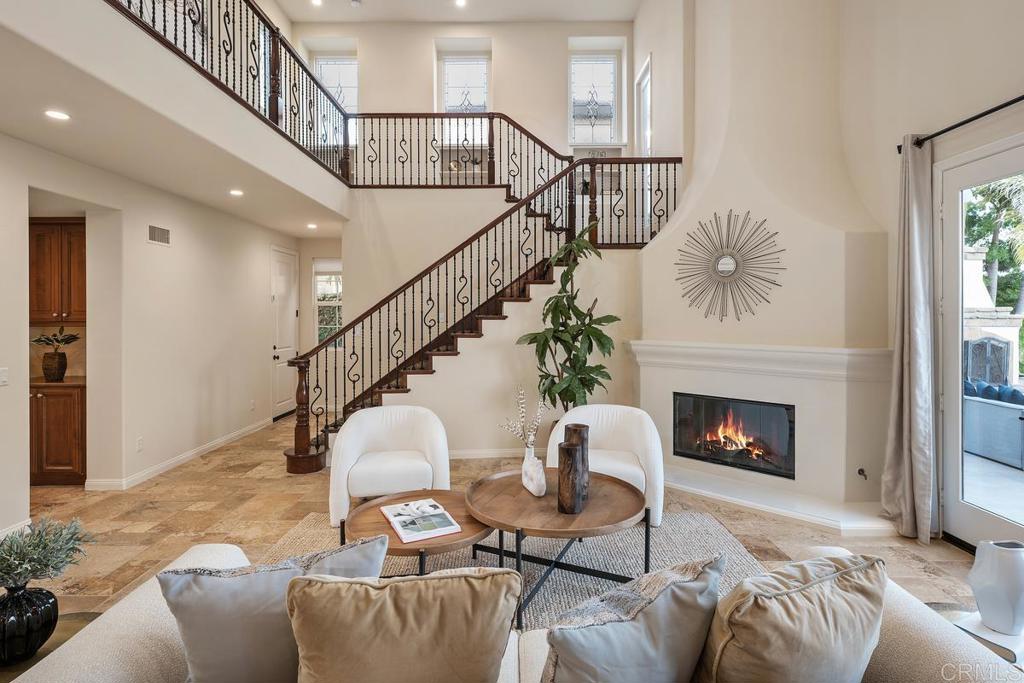7603 Circulo Sequoia Carlsbad, CA 92009 - Photo 27 of 61 a living room with furniture and a fireplace