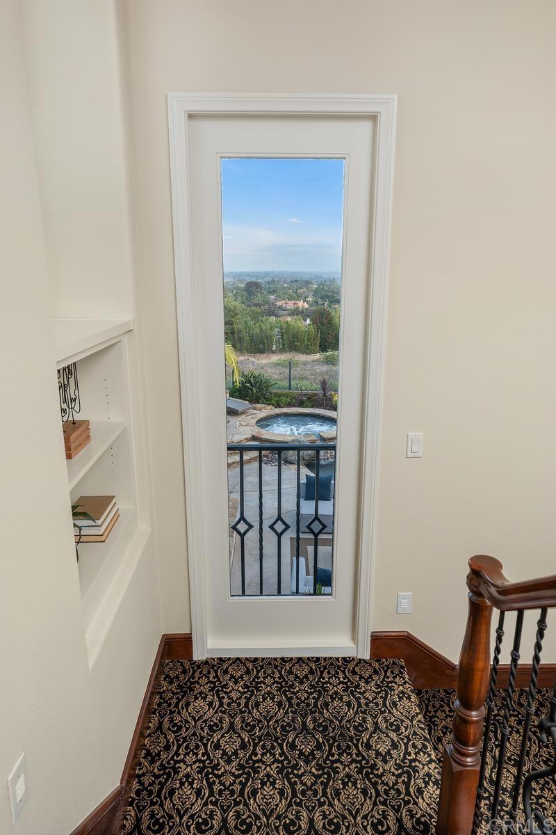 7603 Circulo Sequoia Carlsbad, CA 92009 - Photo 28 of 61 a view of a hallway with a window