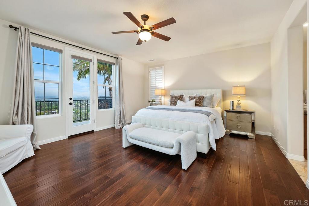 7603 Circulo Sequoia Carlsbad, CA 92009 - Photo 29 of 61 a bedroom with a bed and a large window