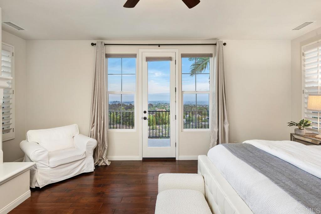 7603 Circulo Sequoia Carlsbad, CA 92009 - Photo 30 of 61 a bedroom with a bed and a large window