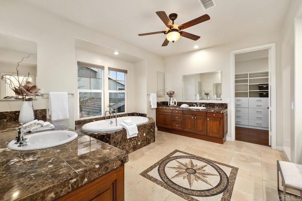 7603 Circulo Sequoia Carlsbad, CA 92009 - Photo 32 of 61 a living room with a couch and a table