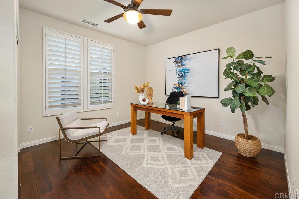 7603 Circulo Sequoia Carlsbad, CA 92009 - Photo 34 of 61 a living room with furniture and a potted plant