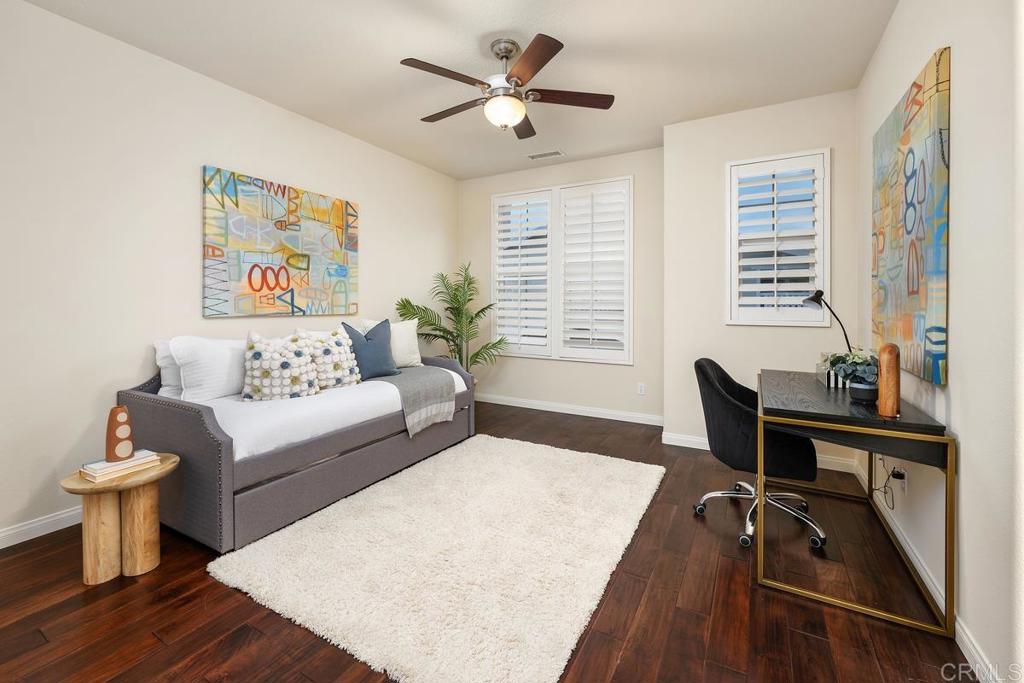 7603 Circulo Sequoia Carlsbad, CA 92009 - Photo 36 of 61 a living room with furniture and a table