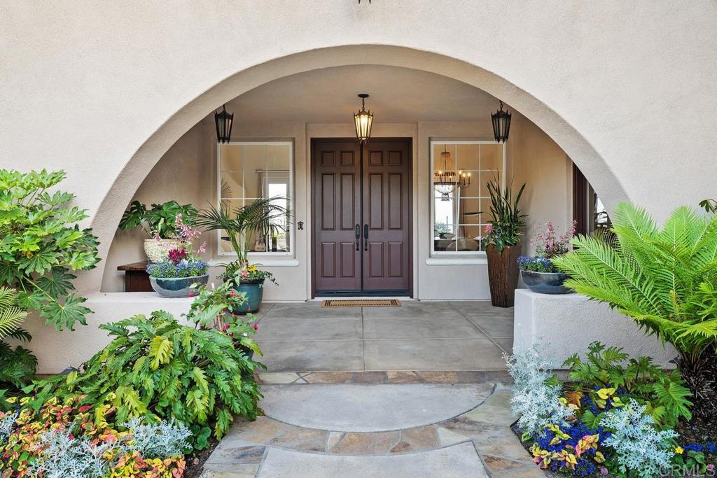 7603 Circulo Sequoia Carlsbad, CA 92009 - Photo 40 of 61 a front view of a house with a yard