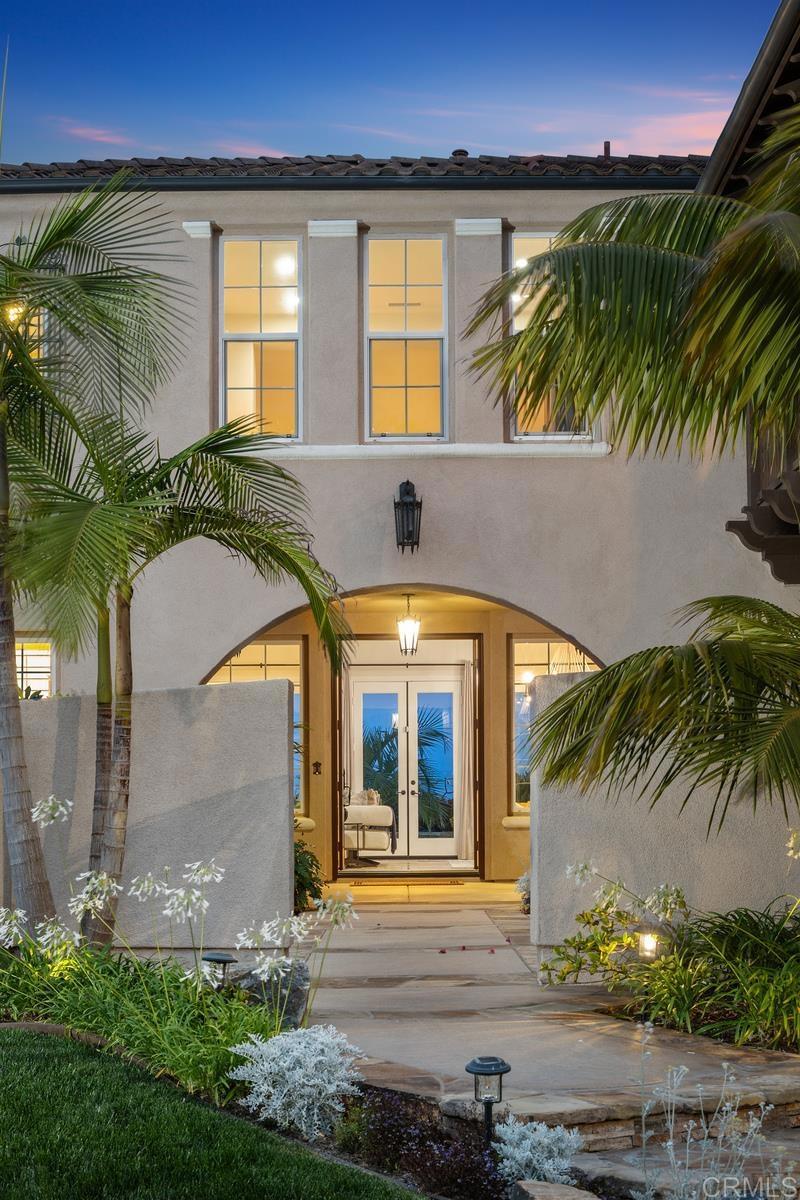 7603 Circulo Sequoia Carlsbad, CA 92009 - Photo 4 of 61 a front view of a house with a yard