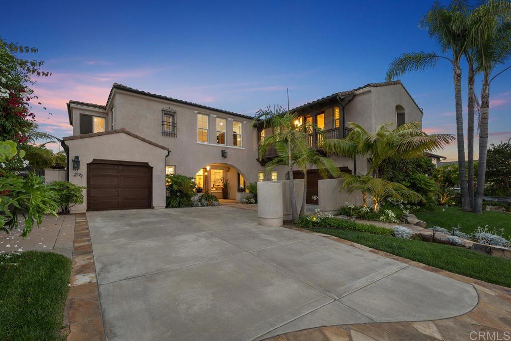7603 Circulo Sequoia Carlsbad, CA 92009 - Photo 49 of 61 a front view of a house with a yard and garage