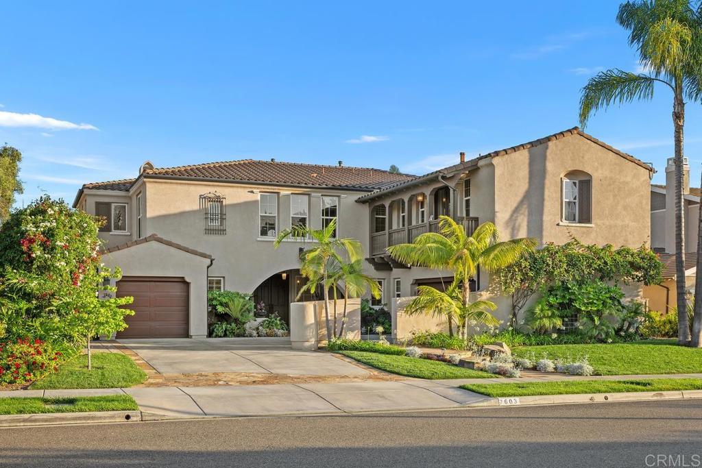 7603 Circulo Sequoia Carlsbad, CA 92009 - Photo 50 of 61 a front view of a house with a yard